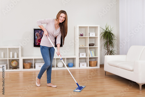 Photo: Young Woman Cleaning Floor Young Woman Cleaning Floor