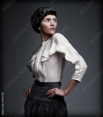 Photo: Trend. Retro Stylized Lady in Pin-Up Style. Vintage Clothing Trend. Retro Stylized Lady in Pin-Up Style. Vintage Clothing