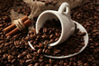Cup with coffee beans, close up