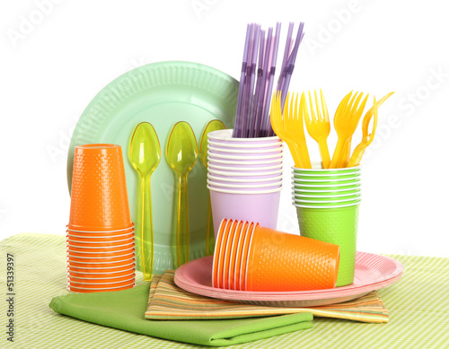 Photo: Multicolored plastic tableware isolated on white Multicolored plastic tableware isolated on white