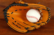 Baseball Glove And Ball On Woo... Baseball Glove And Ball On Woo...