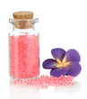 Little bottle full with colorful beads isolated on white