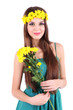 Young beautiful girl in green dress with nice flowers in her