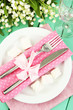 Table setting in white and pink tones