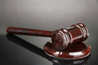 Wooden gavel on grey background
