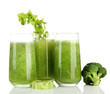 Glasses of green vegetable juice, isolated on white