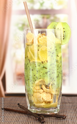 Photo: Delicious fruit smoothie on window background Delicious fruit smoothie on window background