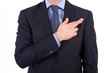 Business man with fingers crossed.