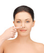 woman touching her nose