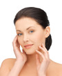 woman touching her face