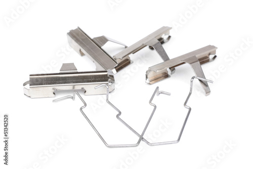 Photo: spring from brake pads , isolatet on white spring from brake pads , isolatet on white