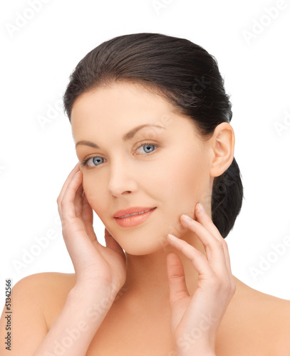 Photo: woman touching her face woman touching her face