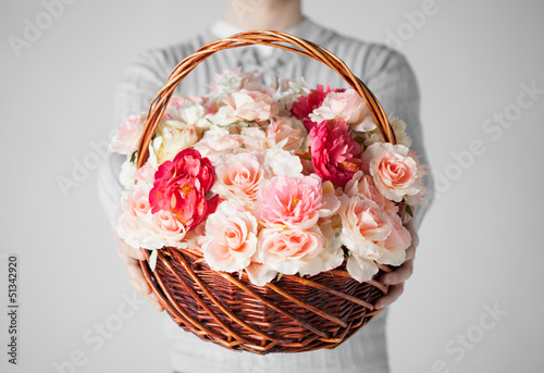 Photo: man holding basket full of flowers man holding basket full of flowers