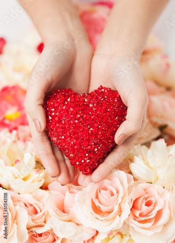 Photo: woman's hands holding heart woman's hands holding heart