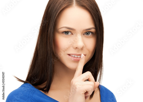 Photo: woman with finger on her lips woman with finger on her lips