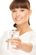 young smiling woman with glass of water