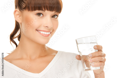 Photo: young smiling woman with glass of water young smiling woman with glass of water