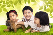 Three siblings and dog in park