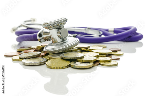 Photo: Stethoscope on Euro coins on a white background Stethoscope on Euro coins on a white background