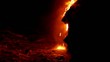 Lava flow at night in to the sea