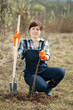Female farmer  planting   shrubbery