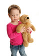 Photo: Child holding a teddy bear with mad expression Child holding a teddy bear with mad expression