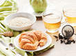 healthy breakfast: croissant, porridge and green tea