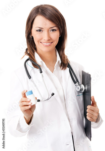 Photo: Cheerful doctor showing medical drug, over white Cheerful doctor showing medical drug, over white