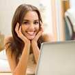 Cheerfull smiling woman working with laptop