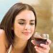 Photo: Young woman with glass of redwine Young woman with glass of redwine