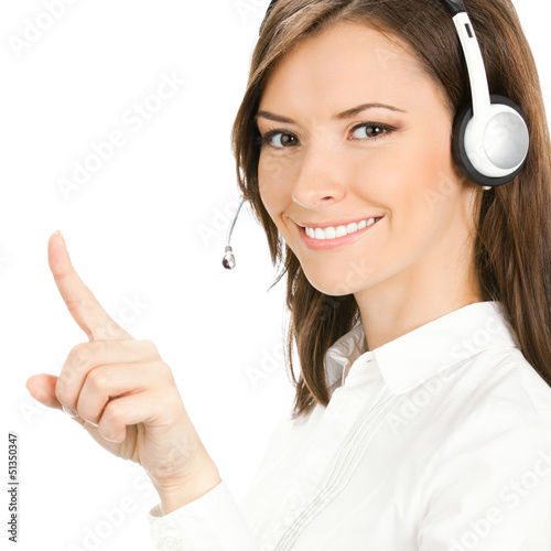Photo: Customer support phone operator in headset pointing Customer support phone operator in headset pointing