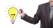 Business man hand drawing light bulb isolated on white