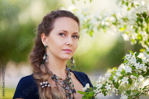 Photo: Beautiful woman in a spring garden Beautiful woman in a spring garden