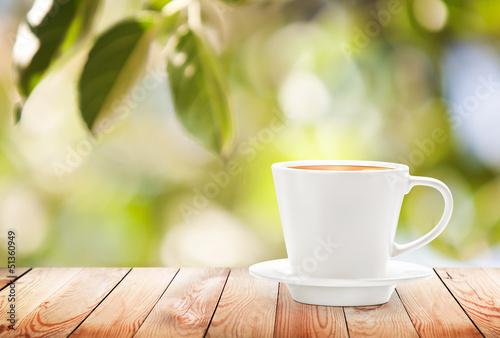 Photo: Cup of hot drink on summer background, free space for text Cup of hot drink on summer background, free space for text