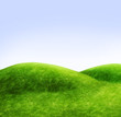 Green hills and a blue sky