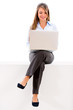 Businesswoman sitting with a laptop