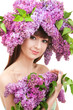 Young woman with flowers on white background