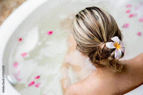 Photo: Back of woman in a tub Back of woman in a tub