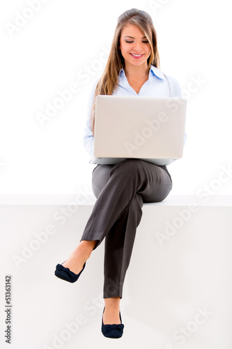 Photo: Businesswoman sitting with a laptop Businesswoman sitting with a laptop