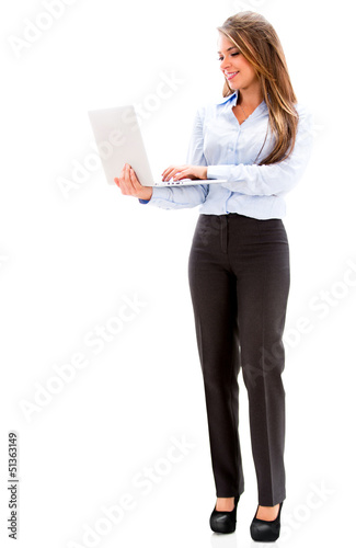 Photo: Business woman holding a laptop. Business woman holding a laptop.