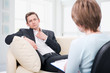 Oppressed man talking with psychologist