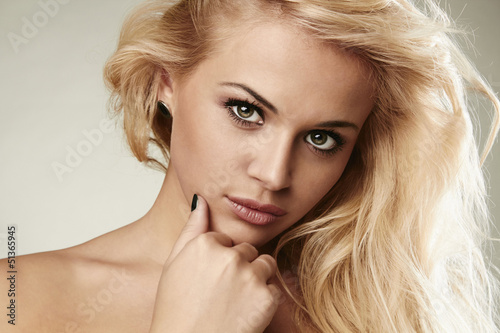Photo: Close-up Portrait of beautiful blond woman Close-up Portrait of beautiful blond woman