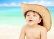 Little naked cowboy on the beach
