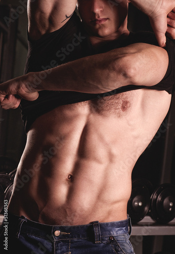 Photo: Sexy male fitness model. Fashion portrait Sexy male fitness model. Fashion portrait