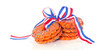 stacked Dutch Queensday cookies with a ribbon isolated on white