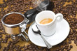 Foto: An espresso machine group head with fresh ground coffee An espresso machine group head with fresh ground coffee