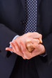 Businessman gesturing with both hands.