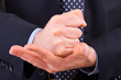 Businessman gesturing with both hands.