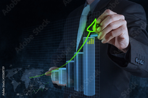Photo: businessman hand working with new modern computer and business s businessman hand working with new modern computer and business s