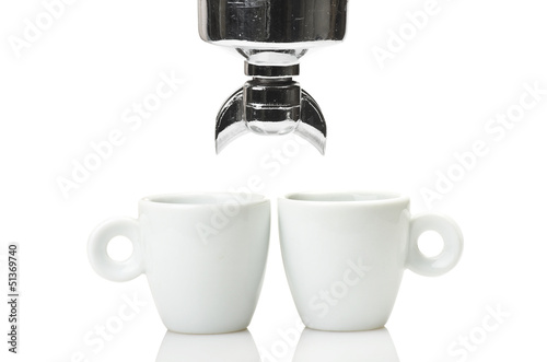 Photo: An espresso machine group head and two cup An espresso machine group head and two cup